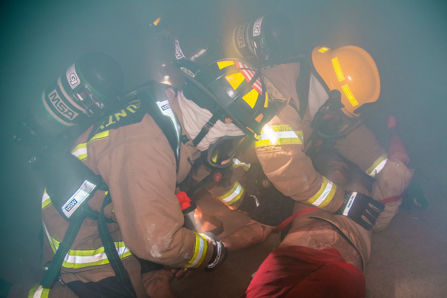 Firefighters trained using a fog machine to help simulate smoke. The building was also darkened to create a more realistic exercise for firefighters.