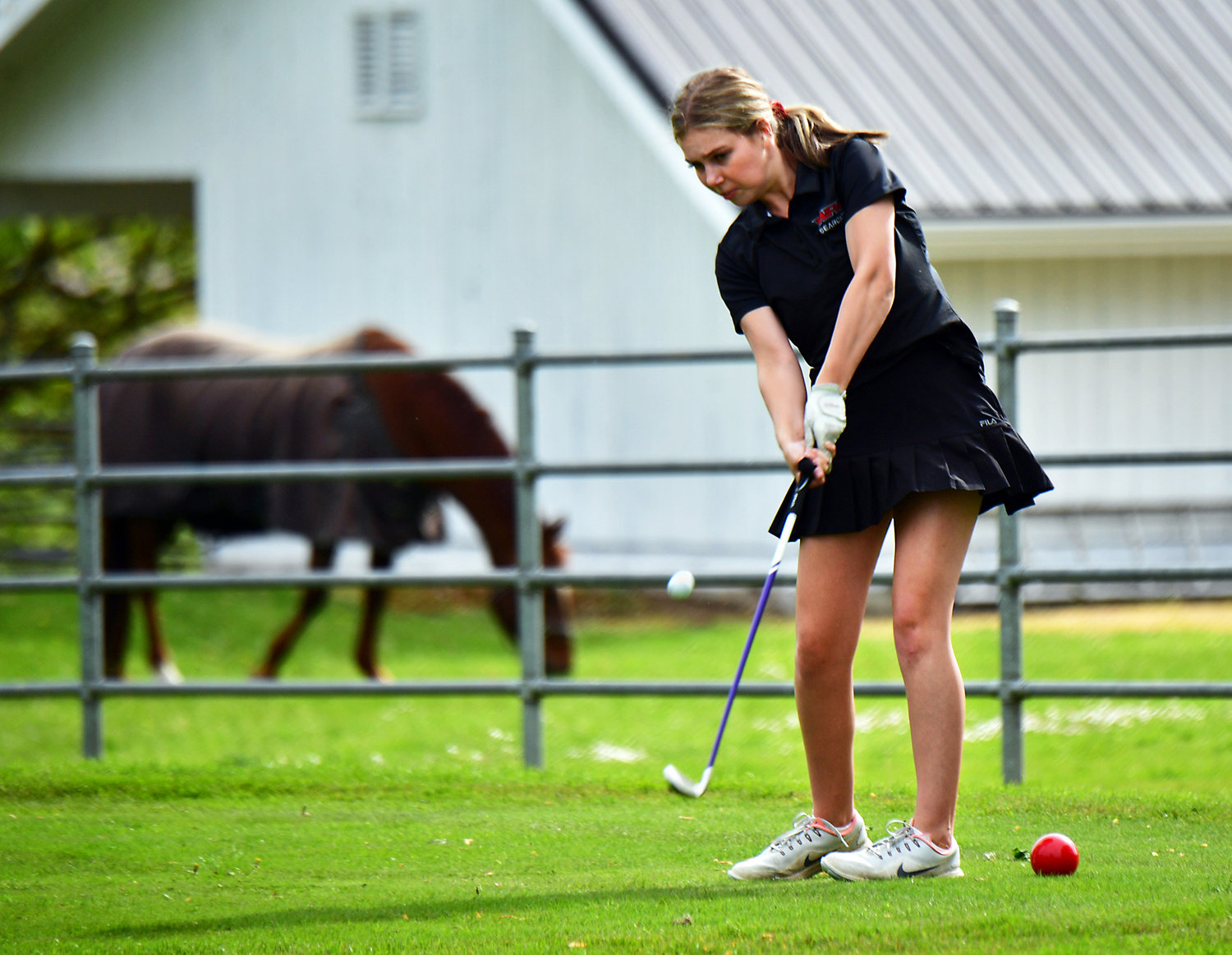 FILE PHOTO - W.F. West High School golfer Laney Barker hits from the tee on Hole No. 22 Wednesday, April 28, at Newaukum Valley Golf Course in Chehalis. W.F. West hosted Rochester High School in the two-team match.