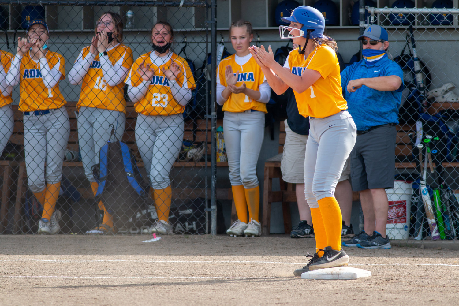Adna senior Haley Rainey claps while her teammates celebrate before beating Ocosta in the district semifinals on Thursday.
