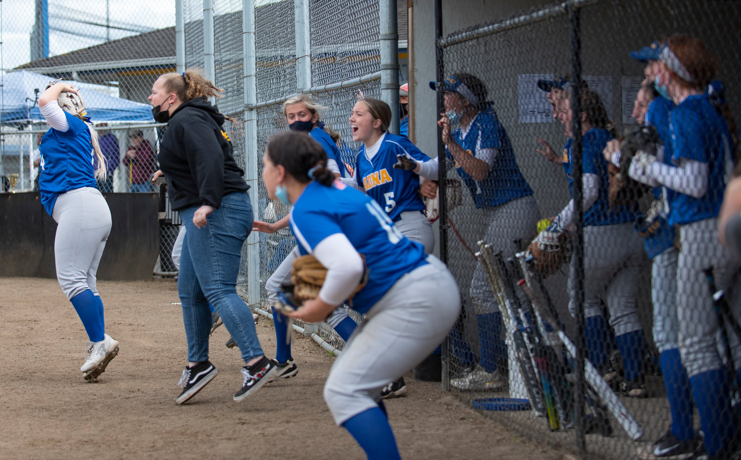 Adna's dugout reacts to Haley Rainey's walk-off single to give the PIrates a 4-3 win over Forks in eight innings for the district title on Saturday.