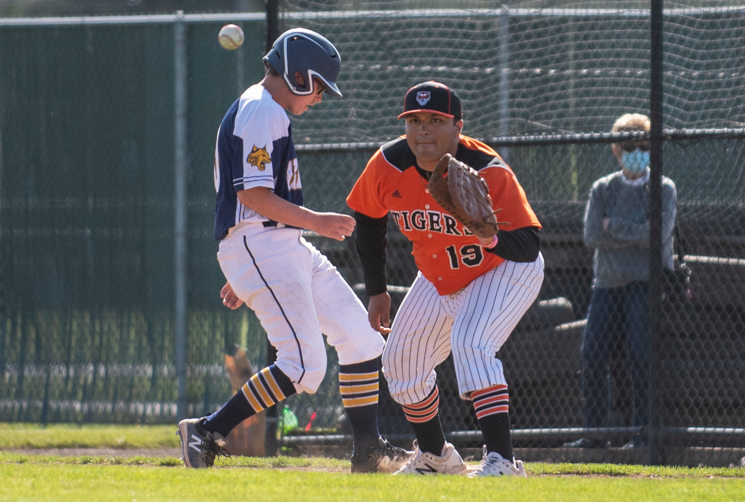 Centralia first baseman Paris Chavez (19) catches a pickoff attempt on Tuesday.