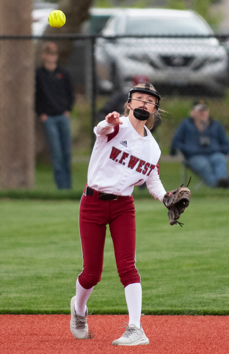 W.F. West sophomore Brielle Etter makes a throw from second base on Thursday.