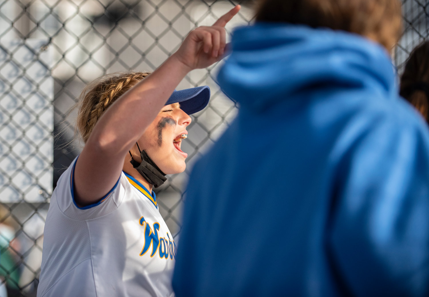 Rochester's Kaylei Clark cheers her team on from the dugout on Thursday against W.F. West.