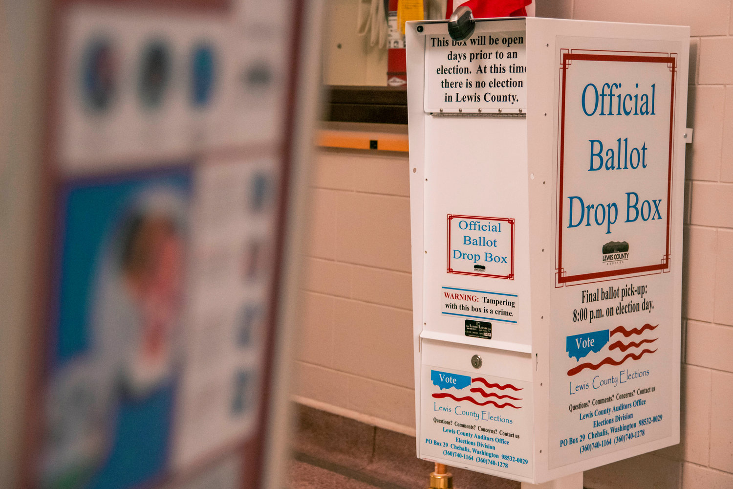 FILE PHOTO — An official ballot drop box sits locked outside the Lewis County Auditor’s Office in Chehalis.