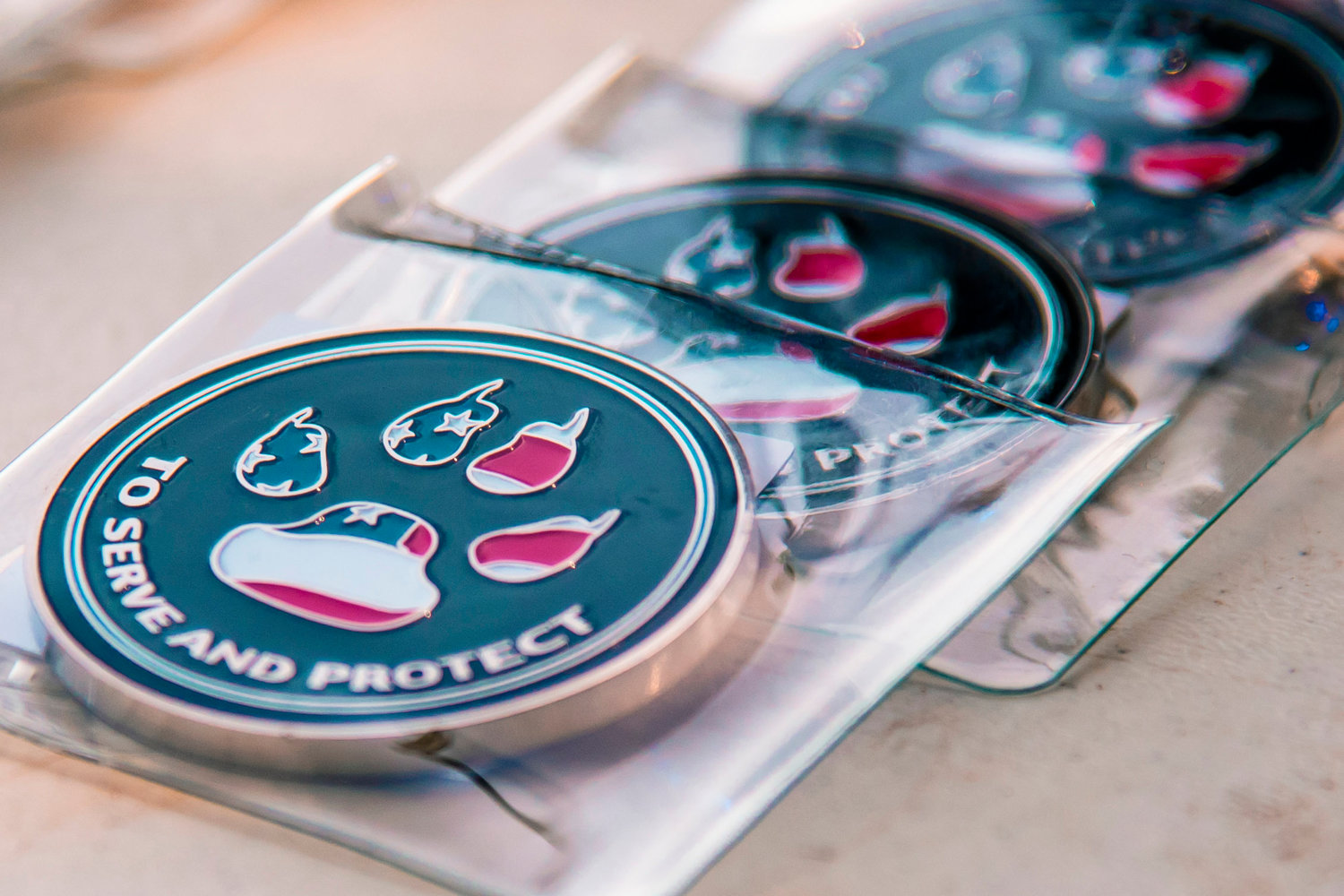 Medallions featuring paws for the K-9 program are displayed during a “Back The Blue” event in Adna.