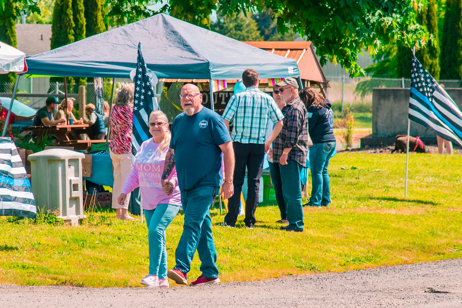 Attendees mingle during a “Back The Blue” event in Adna on Saturday.