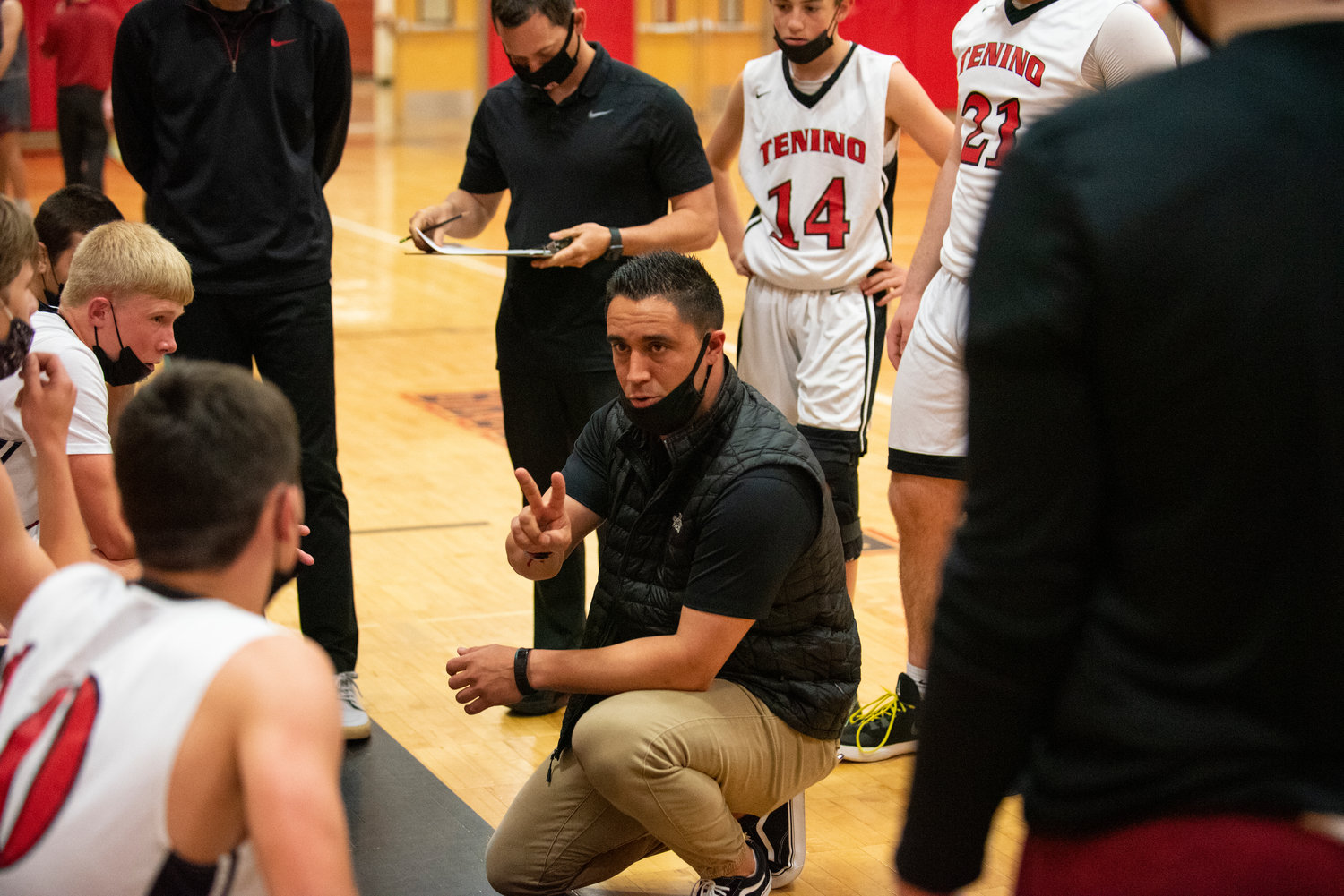 Tenino coach Joe Chirhart runs through the Beavers' gameplan between the first and second quarters of their home game against Hoquiam on Wednesday.