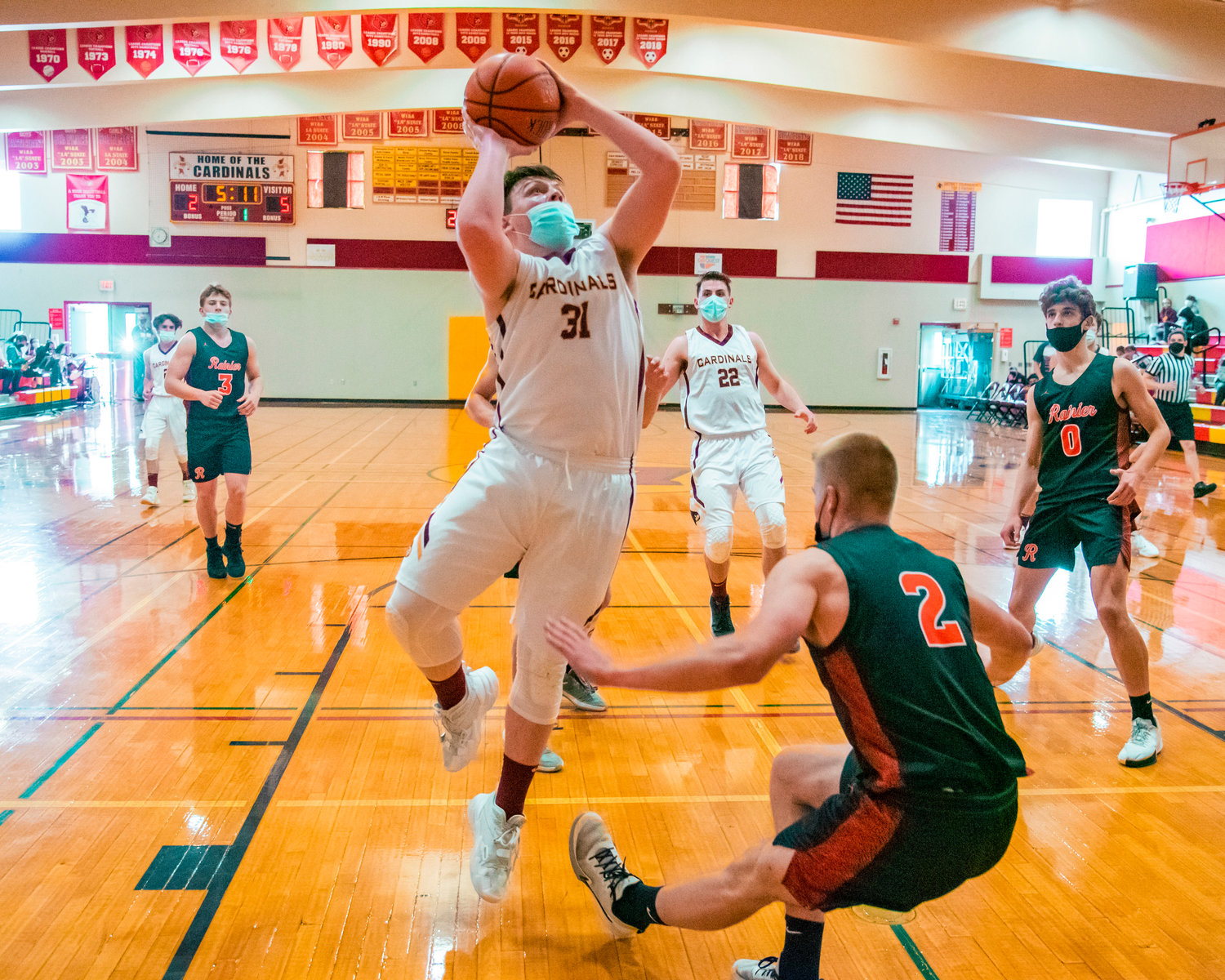 Winlock’s Nolan Swofford (31) goes up with the ball during a game against Rainier on Wednesday.