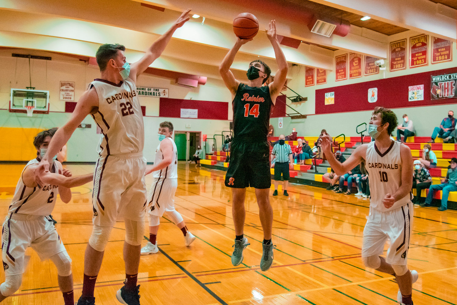Rainier’s Thomas Ronne (14) goes up for a shot during a game against Winlock on Wednesday.