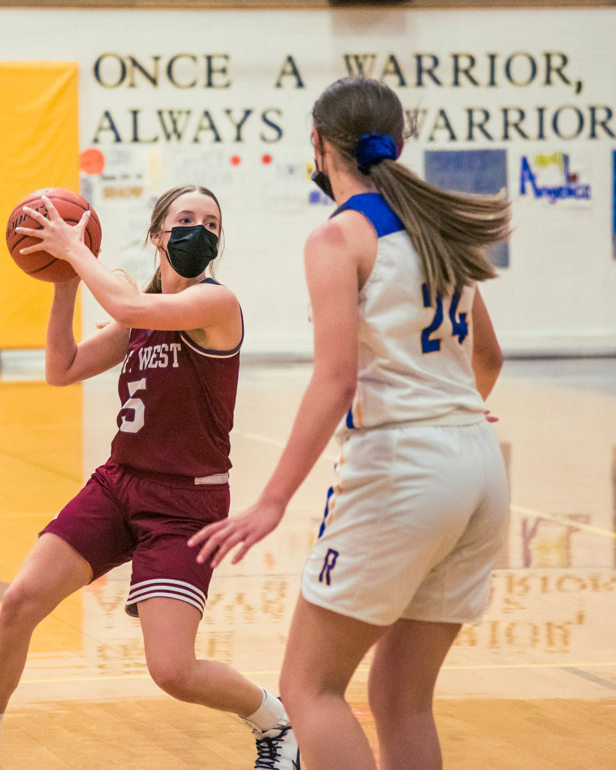 W.F. West's Mak Mencke (5) looks for a pass against Rochester on Friday.
