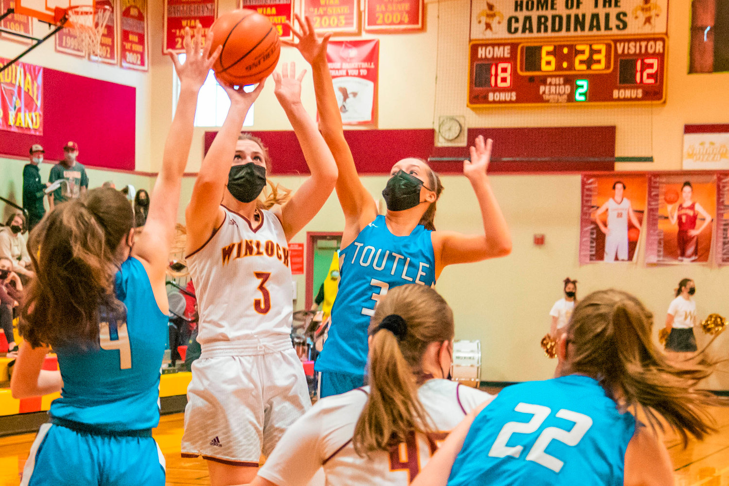 Winlock’s Karlie Jones (3) puts up a shot while surrounded by defenders during a game on Thursday.