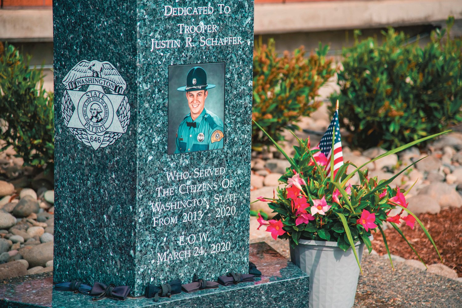 Bowties were placed around a memorial dedicated to trooper Justin R. Schaffer on Sunday in Chehalis.