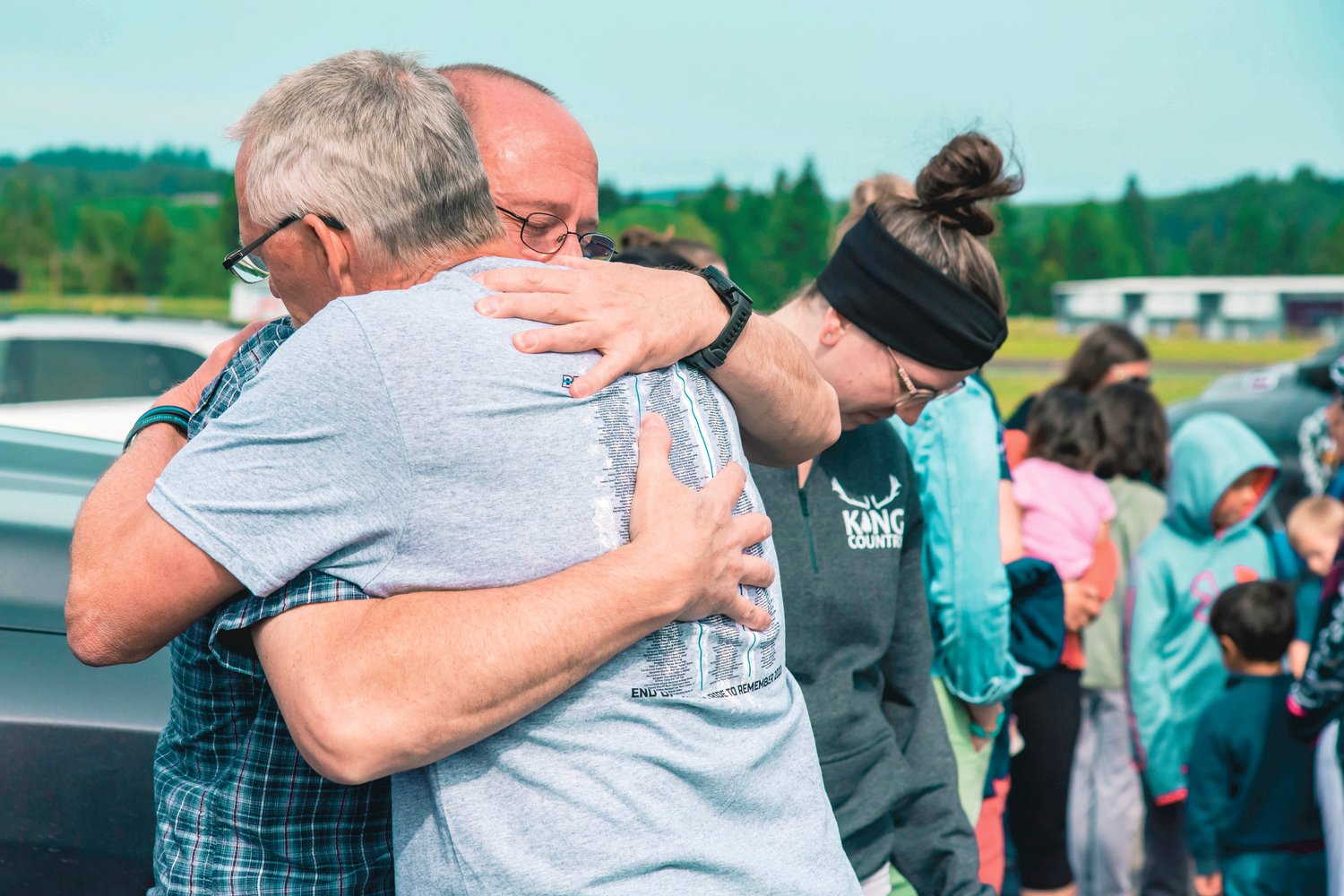 Glenn Schaffer, father of trooper Justin R. Schaffer, embraces a visitor during the Beyond the Call of Duty Ride to Remember 2020 that stopped by the Chehalis Washington State Patrol office in his honor on Sunday.
