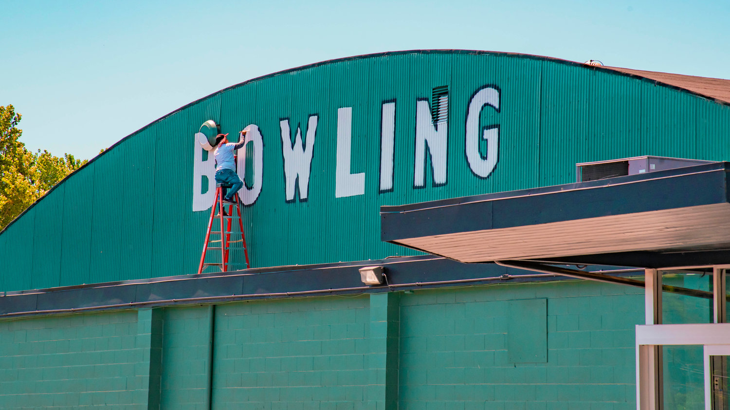Jared Wenzelburger / jared@chronline.com
The “Bowling” sign is repainted on Tuesday at the Fairway Lanes bowling alley in Centralia. The business closed amid pandemic restrictions in 2020 and has since been sold. Julie and Jeff Walker now hold the keys to the 62-year-old joint. Last month, they wrote on Facebook that the business would reopen soon.  “We are working on getting up and running again soon,” they wrote on May 10.  “Probably going to be sometime this summer.  We are making some changes and updates and we hope to be fully operational for fall leagues. Registration updates will be posted at a later date. Thanks everyone for their patience and let’s get back to bowling.”