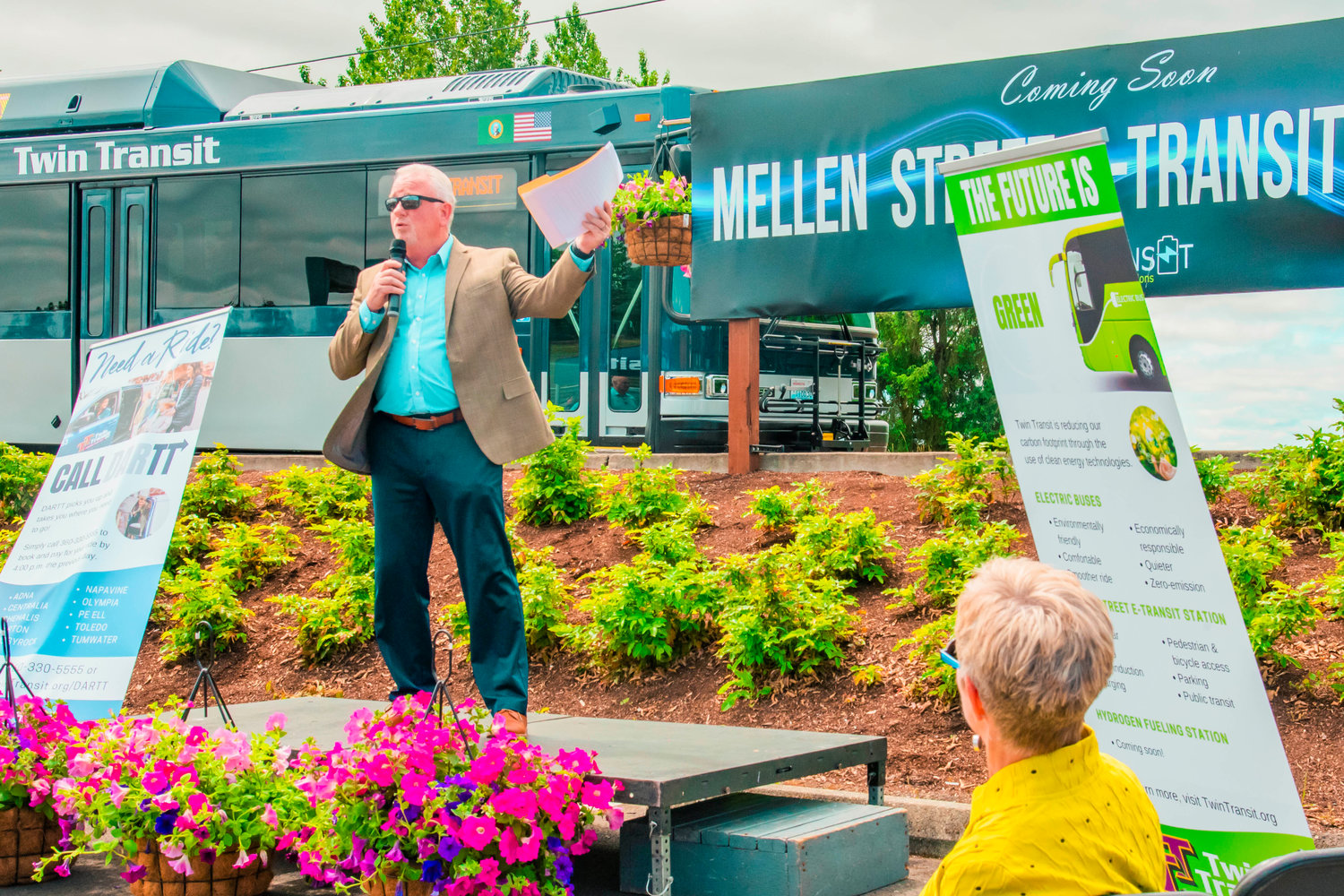 Twin Transit Executive Director Joe Clark speaks during the unveiling of the Mellen Street e-Transit Station in Centralia on Thursday.