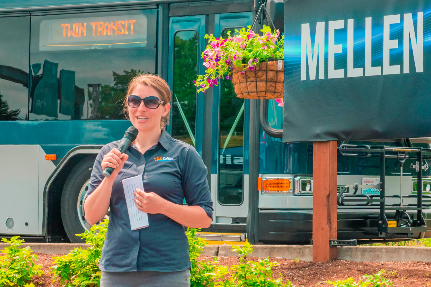 Andrea Culletto, director of Twin Transit’s community relations, smiles as she talks during the unveiling of the Mellen Street E-transit Station in Centralia on Thursday.