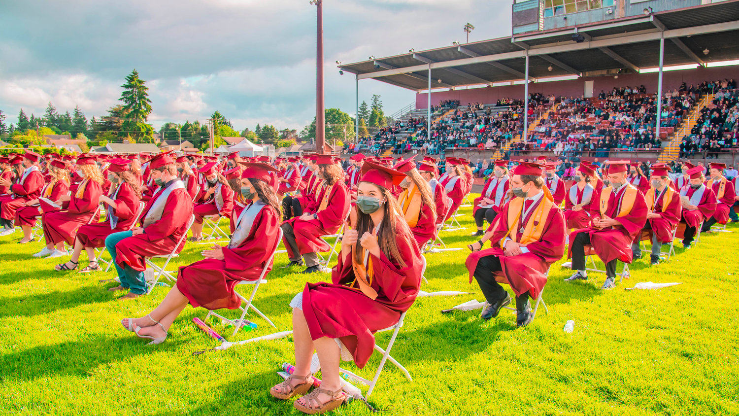 Graduates prepare to receive their diplomas during a ceremony in Bearcat Stadium at W.F. West in Chehalis on Saturday.