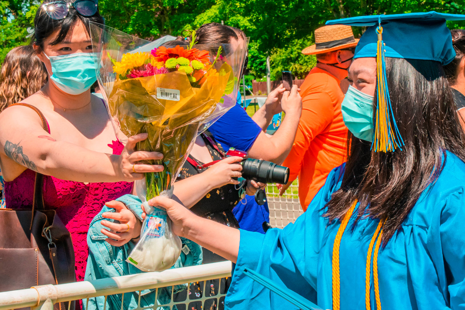 Karen Wu is greeted with flowers during the Centralia College graduation ceremony Friday afternoon.