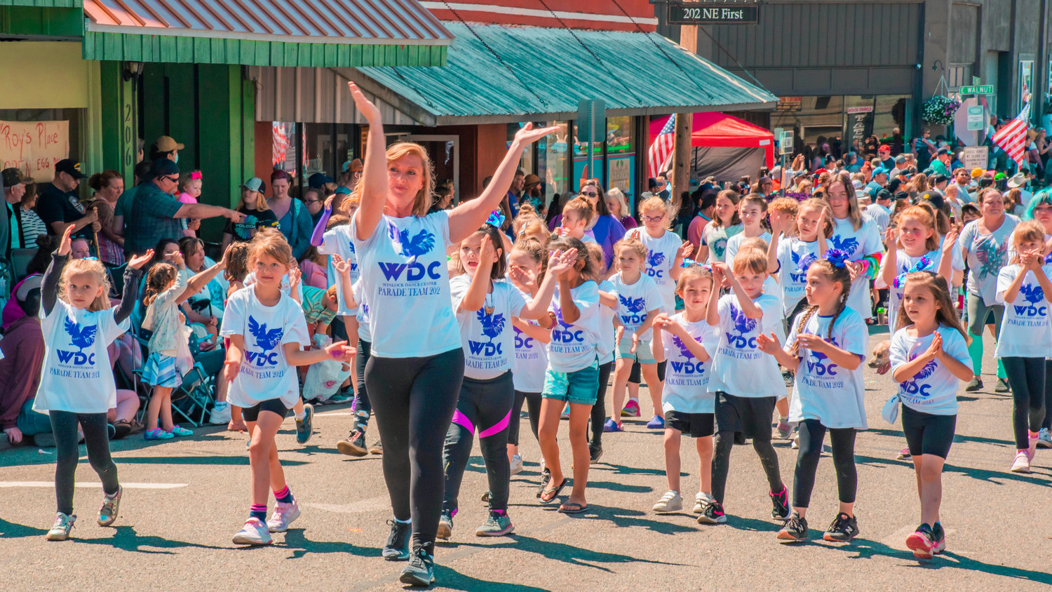 Members of the Winlock Dance Center Parade Team dance through the streets during the Winlock Egg Days parade on Saturday.