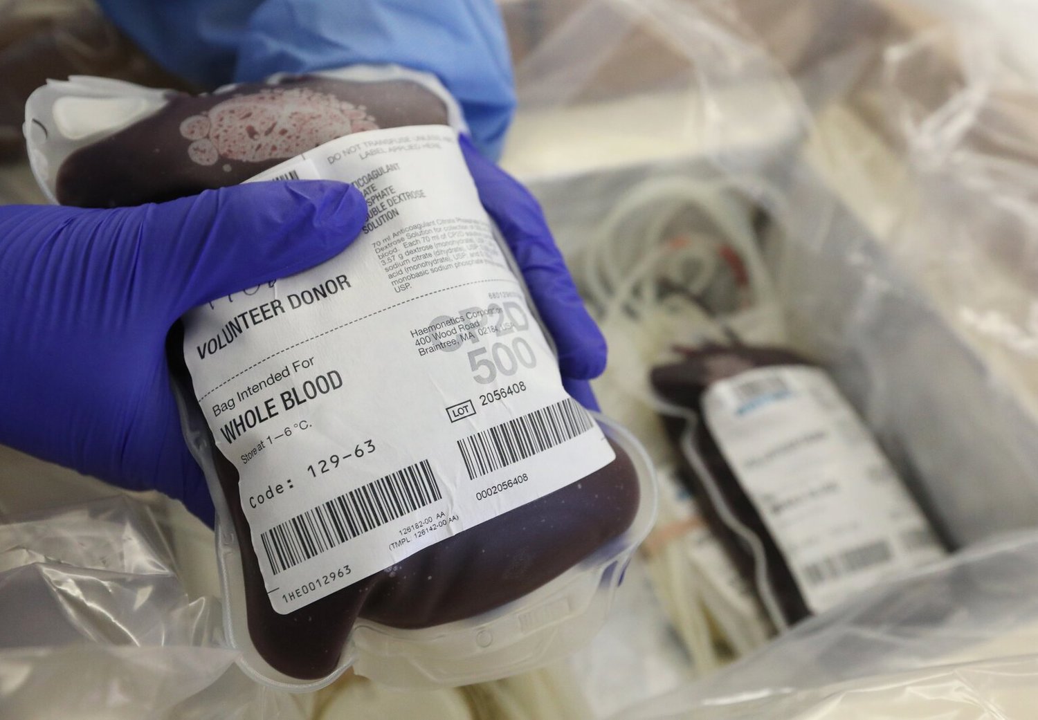 Donated blood is prepared to be shipped at Bloodworks Northwest, on Monday in Seattle. The region’s hospitals and trauma centers are experiencing a critical shortage in blood supply as donors have dropped off and more hospital operations resume.