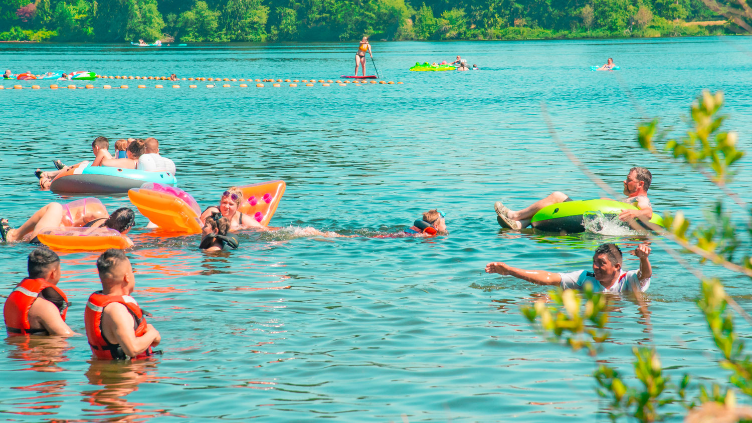 Visitors at Millersylvania State Park swim in Deep Lake to remain cool during an excessive heat warning across Washington on Sunday.