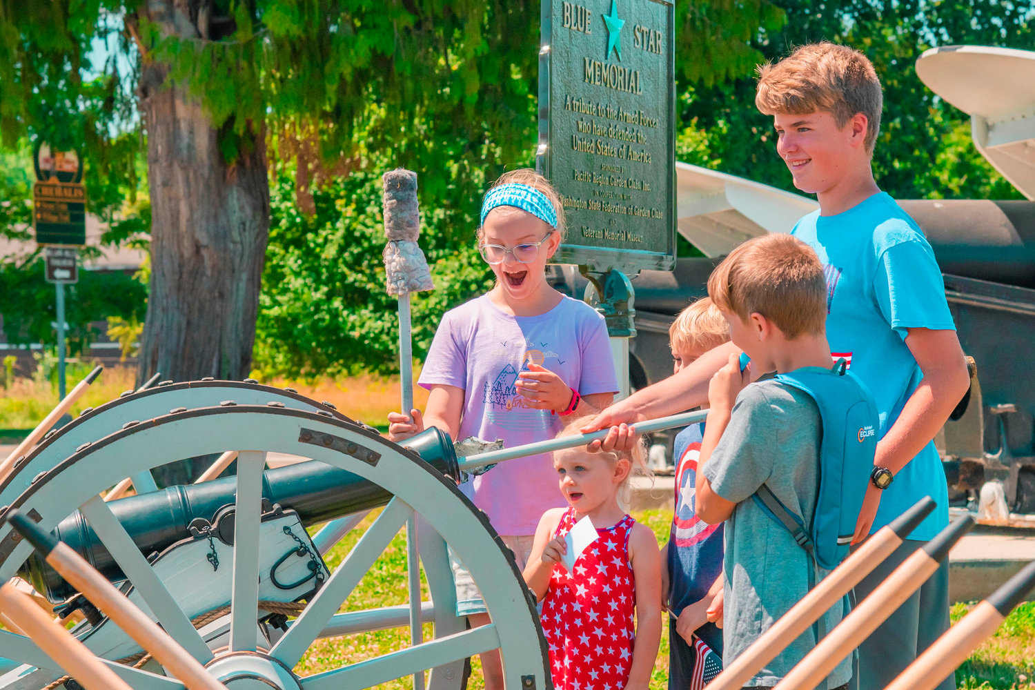 Kids use ramrods on a cannon during 1776 Day at the Veterans Memorial Museum in Chehalis Saturday.