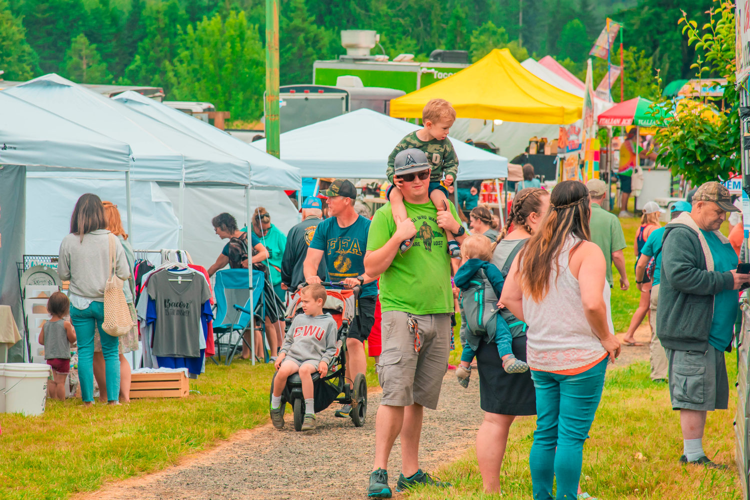 Visitors line up at vendors throughout Klickitat Prairie Park in Mossyrock during Freedom Festival celebrations on Saturday.