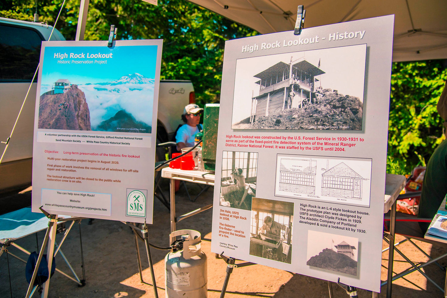 Posters detail the history of High Rock Lookout and goals for the historic preservation project.