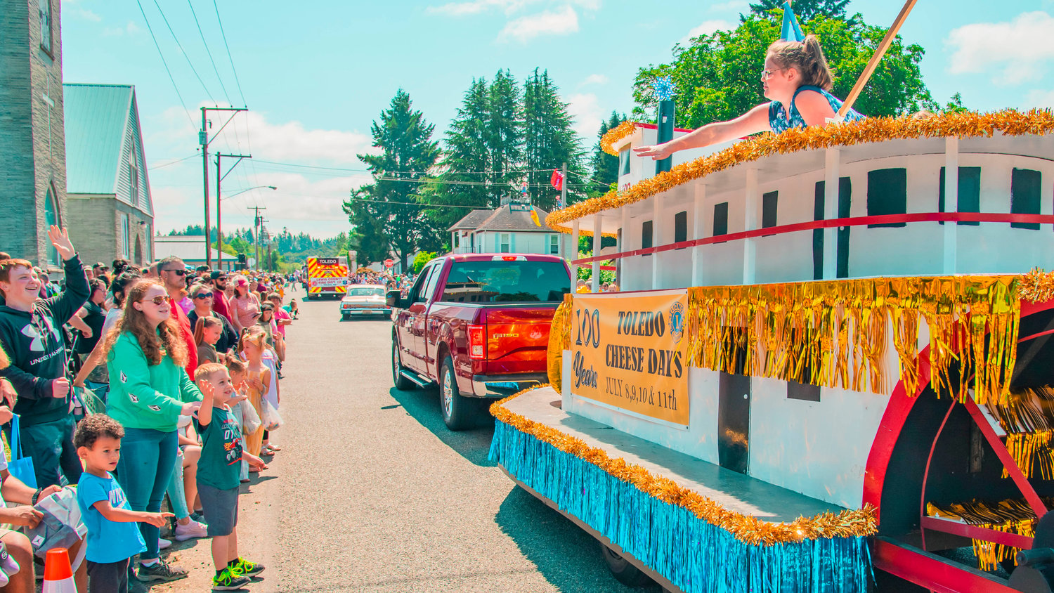 Candy is thrown to crowds from a Toledo Cheese Days float during the parade in 2021.