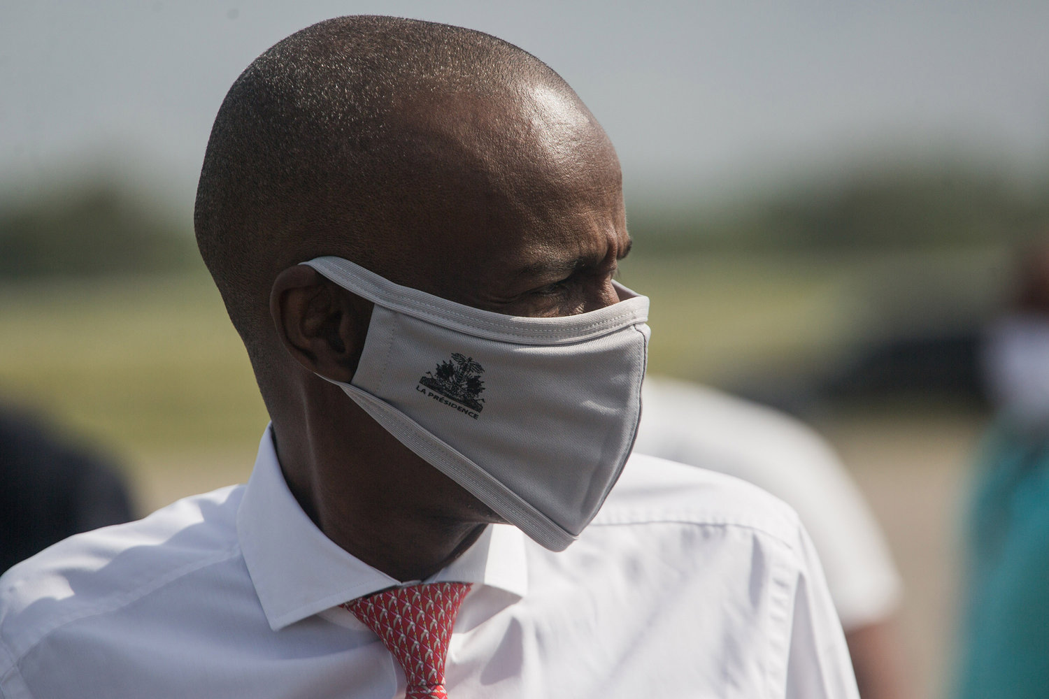Haitian President Jovenel Moise walks on the tarmac of Toussaint Louverture International Airport in Port-au-Prince, Haiti, on May 7, 2020, as coronavirus aid from China arrives in a cargo plane.