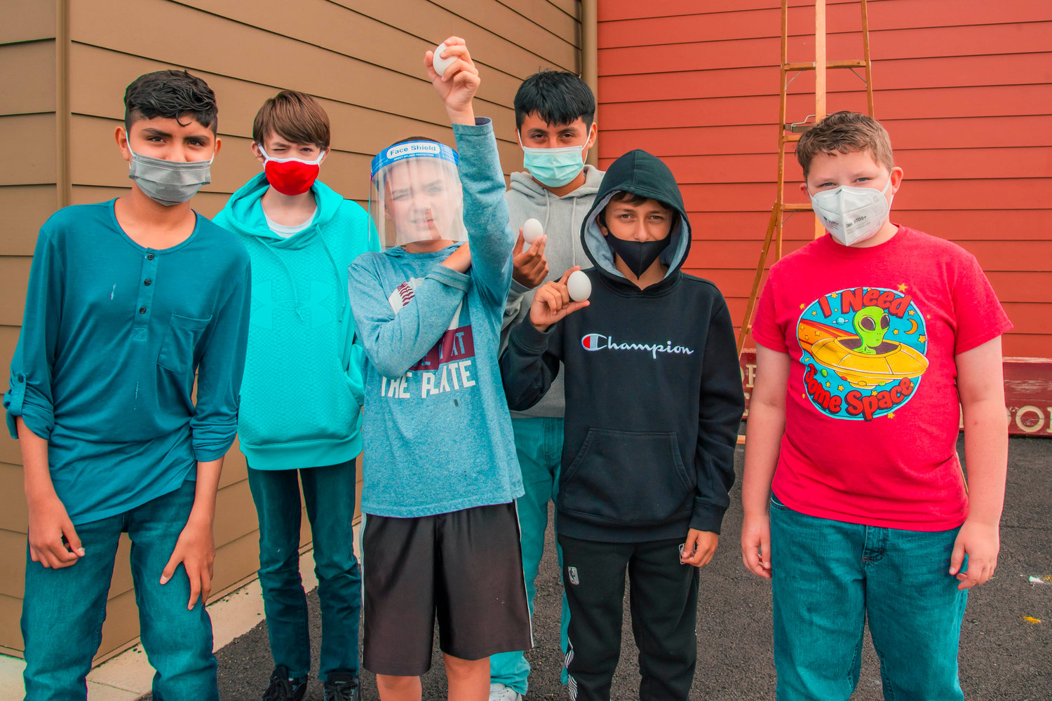 Javier Cervantes, Roman David, Timothy Brossard, Alexander Cruz, Evan Tackman and Matthew Burns, sixth-graders in the Summer School program at Fords Prairie Elementary School, pose for a photo with surviving eggs during a science project Thursday in Centralia .