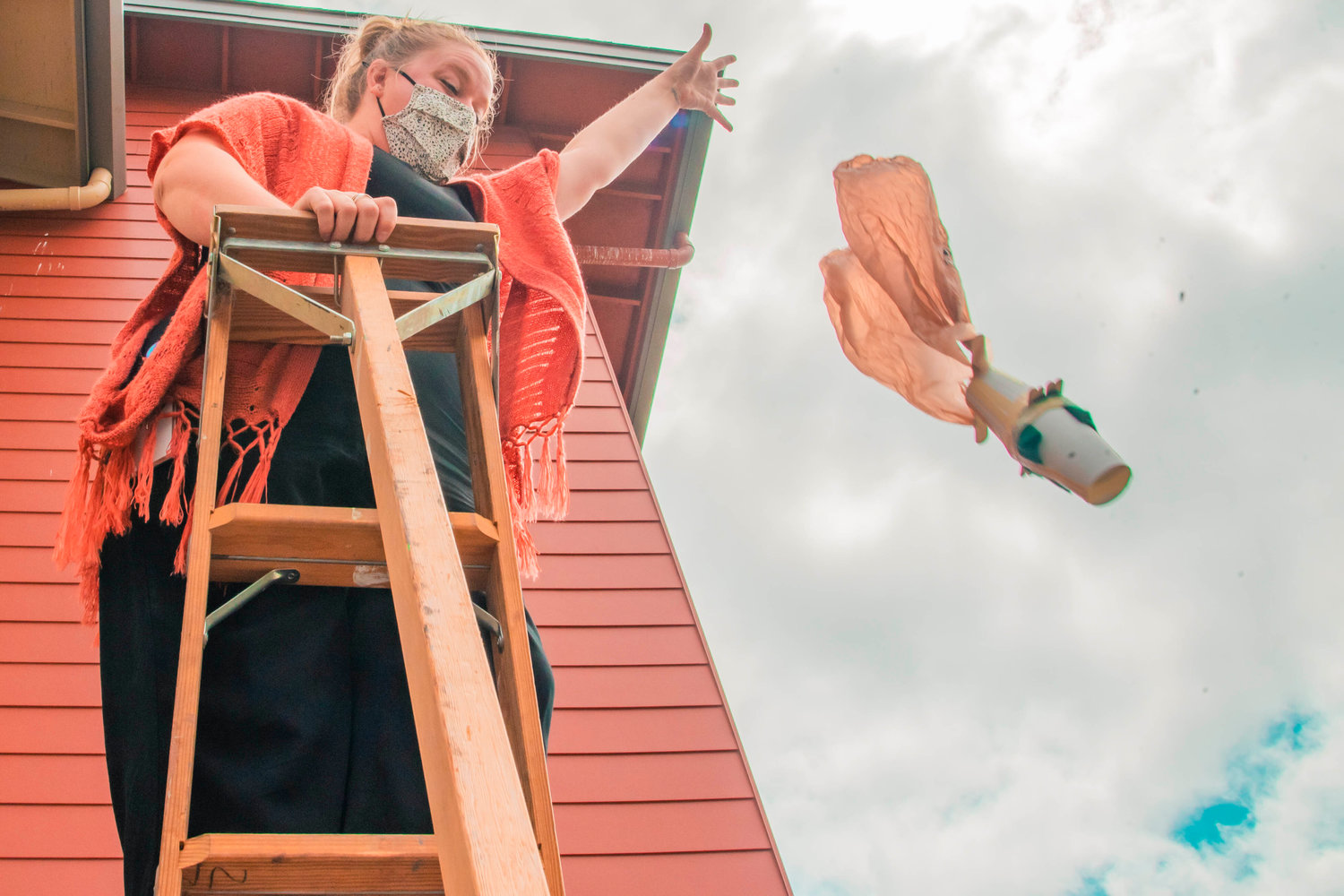 Sixth-grade student creations drop to the ground from a high ladder in an effort to protect an egg inside during a science project Thursday at Fords Prairie Elementary in Centralia.