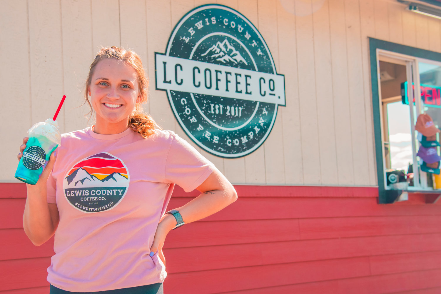 Emily Silva smiles and poses with a drink at Lewis County Coffee Co. in Chehalis on Thursday.