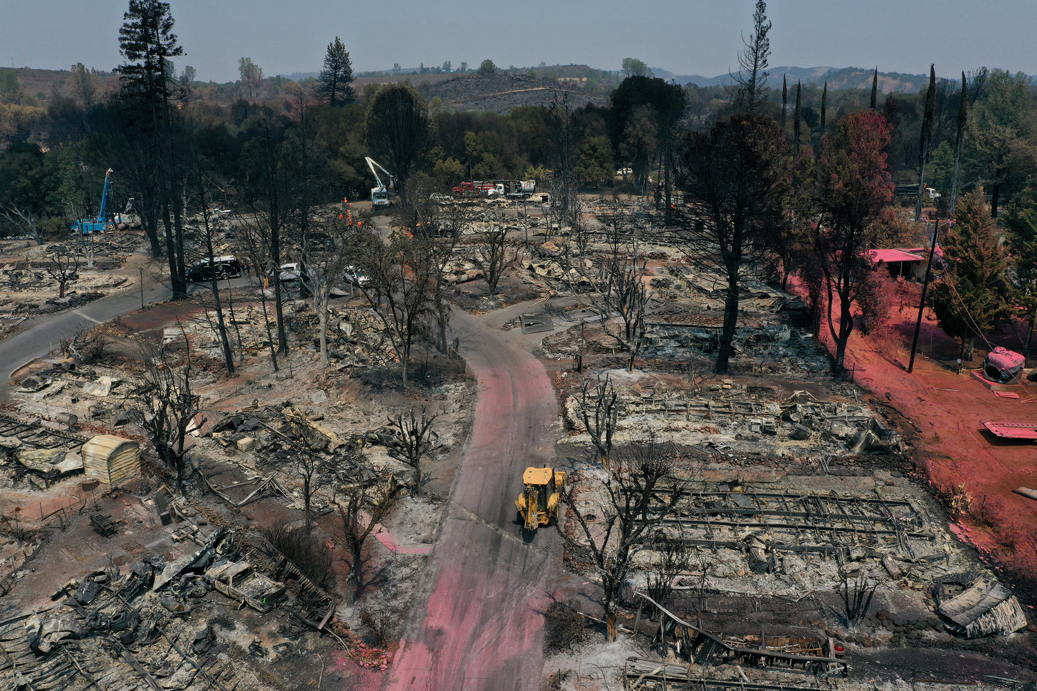 In an aerial view, burned mobile homes are visible at the Creekside Mobile Home Park a day after being destroyed by the Cache fire on August 19, 2021, in Clearlake, California. (Justin Sullivan/Getty Images/TNS)