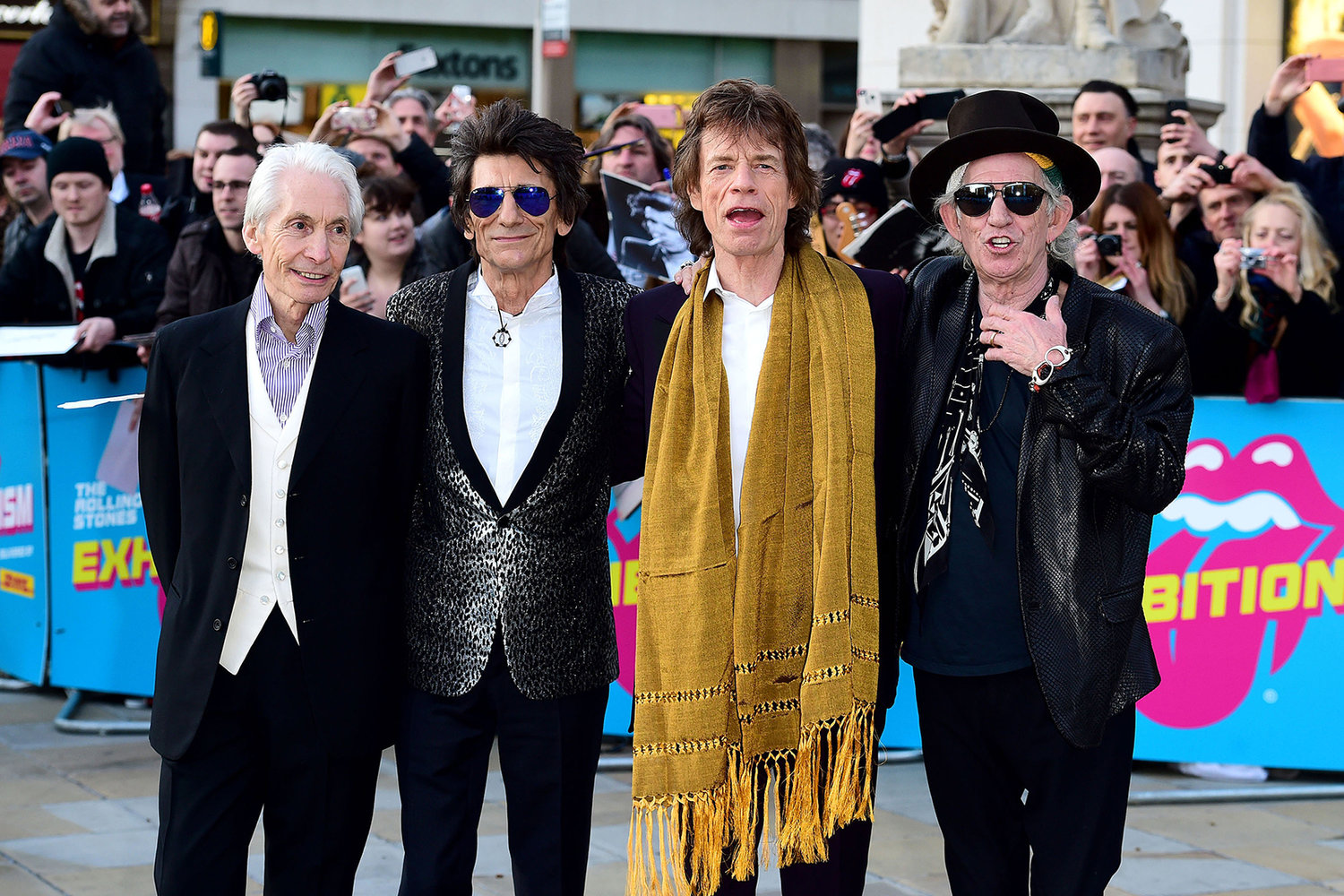 From left, Charlie Watts, Ronnie Wood, Mick Jagger and Keith Richards of The Rolling Stones on April 4, 2016, in London. Watts has died at age 80. (Ian West/PA Wire/Zuma Press/TNS)