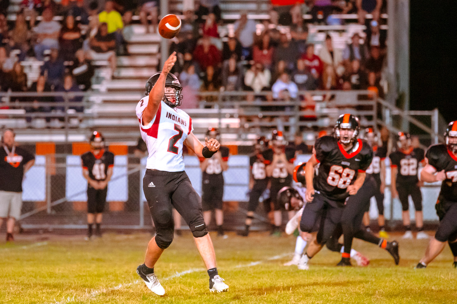 Toledo’s Wyatt Nef (2) completes a pass during a game against the Mountaineers Friday night at Rainier High School.