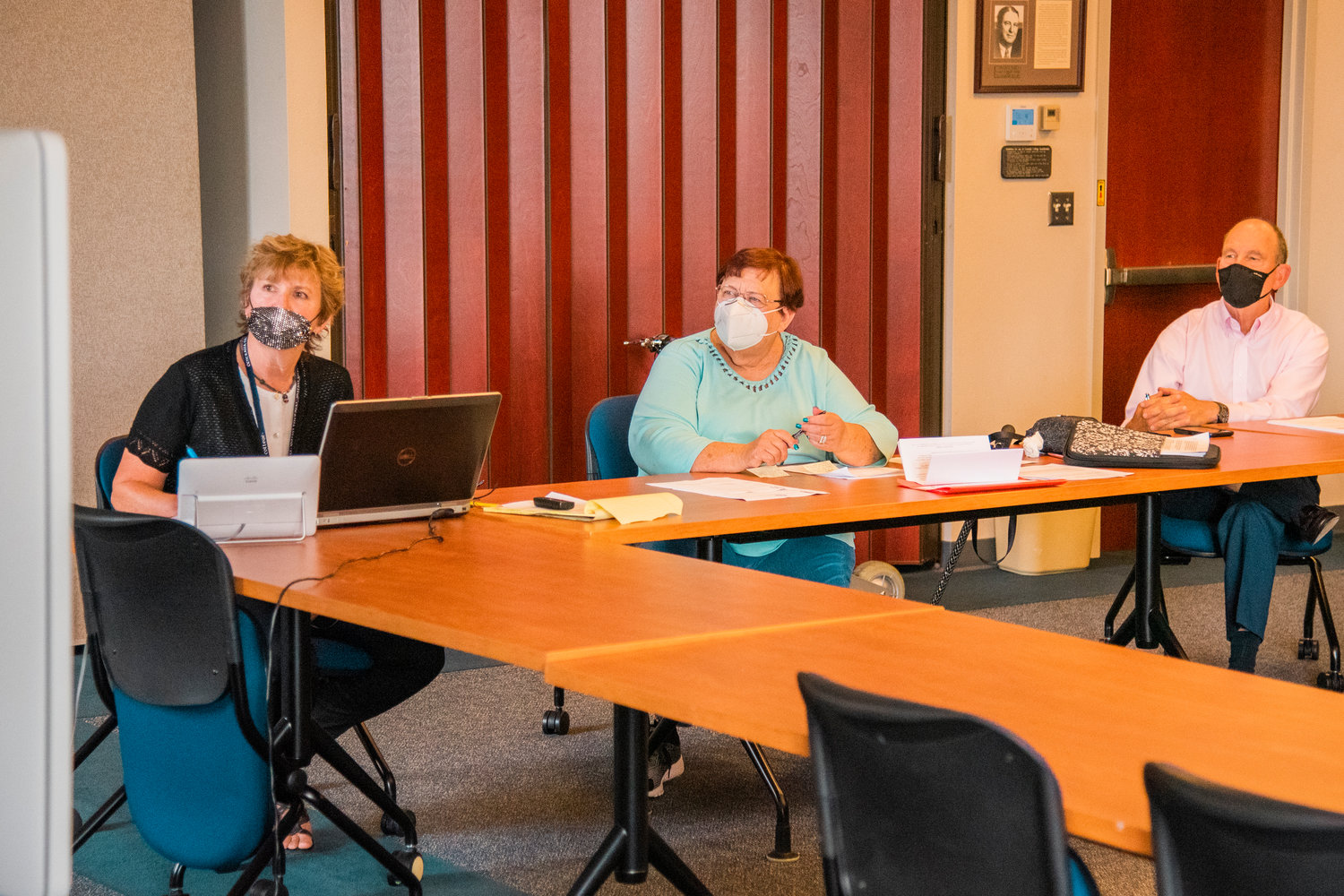 Board of Trustees Chair Doris Wood-Brumsickle, center, talks during a meeting in the Hanson Administration Building at Centralia College on Thursday.