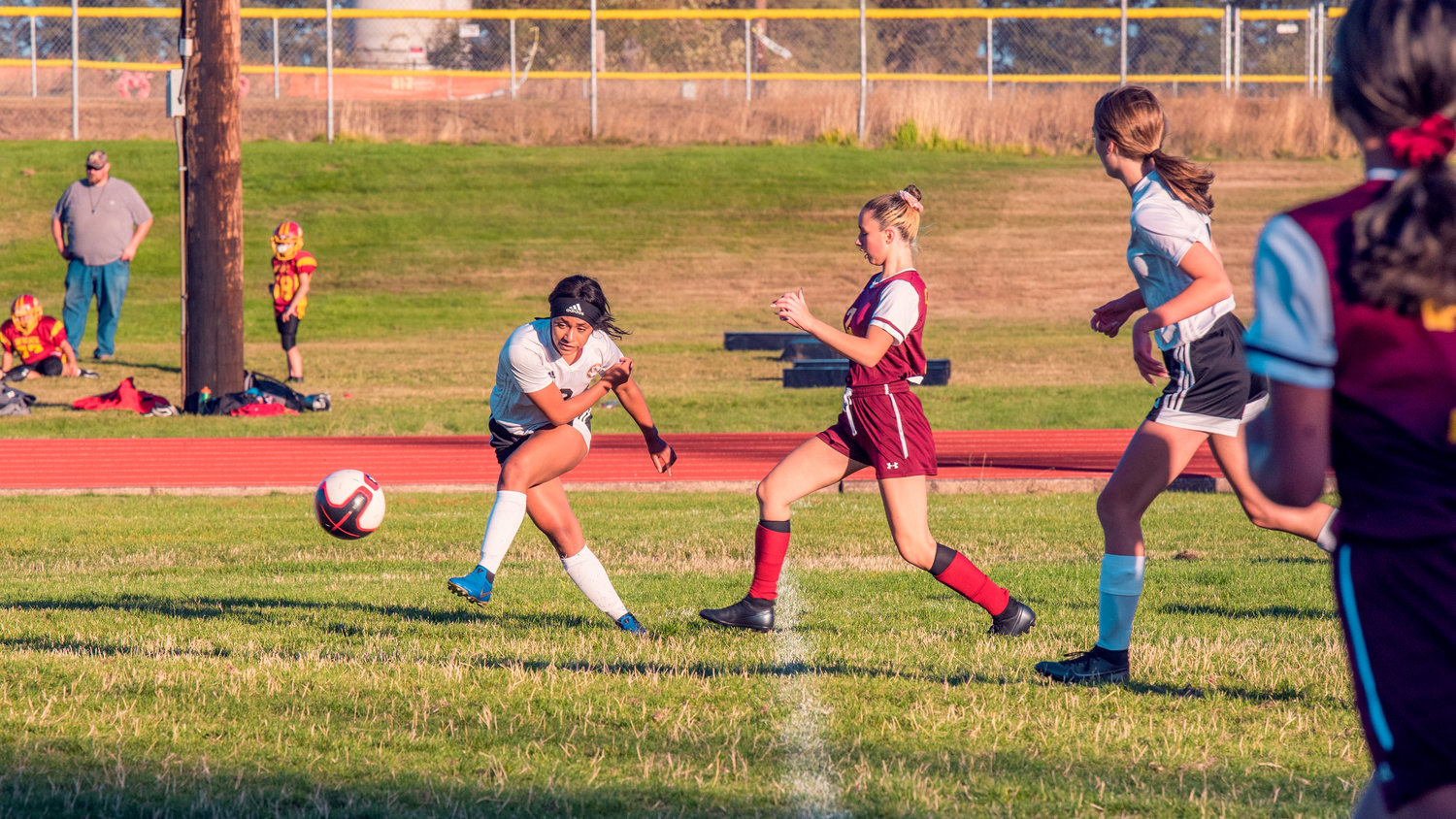 Napavine’s Makensee Taliaferro Bouge (2) kicks the ball down field during a game against Winlock on Wednesday.