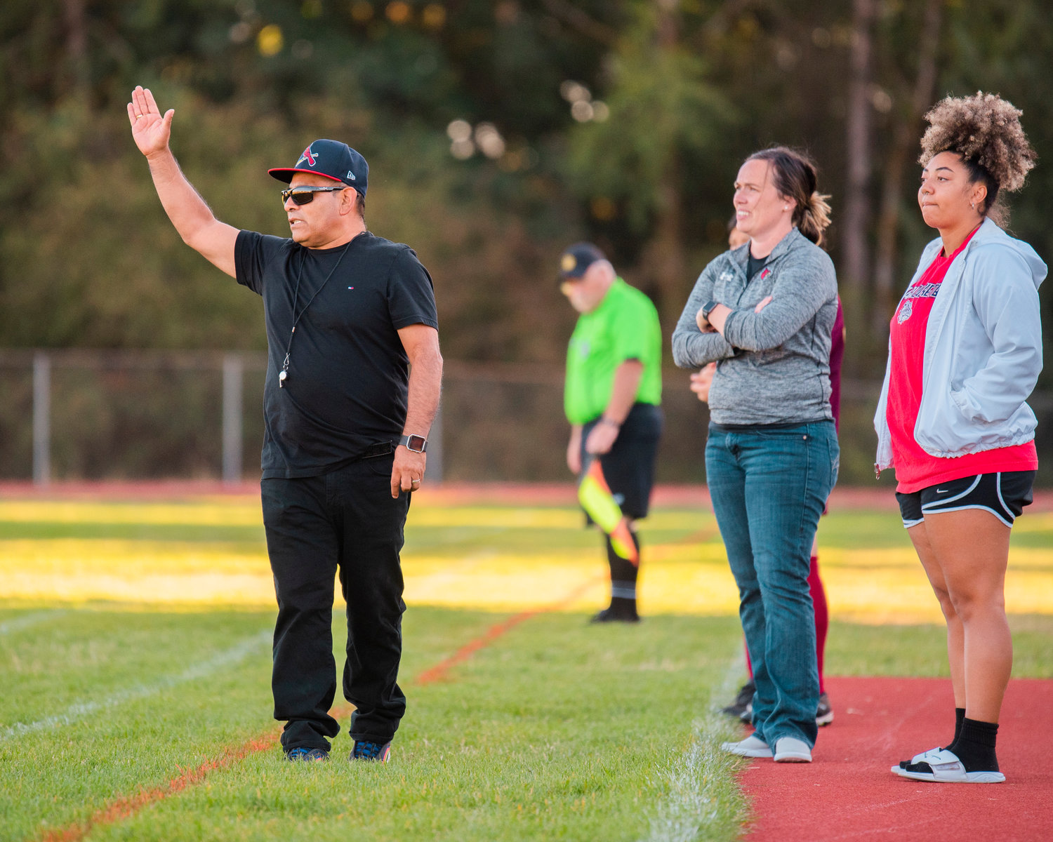 Winlock Head Coach Corny Sanchez talks to players from the sideline, during a game against Napavine, Wednesday at home.