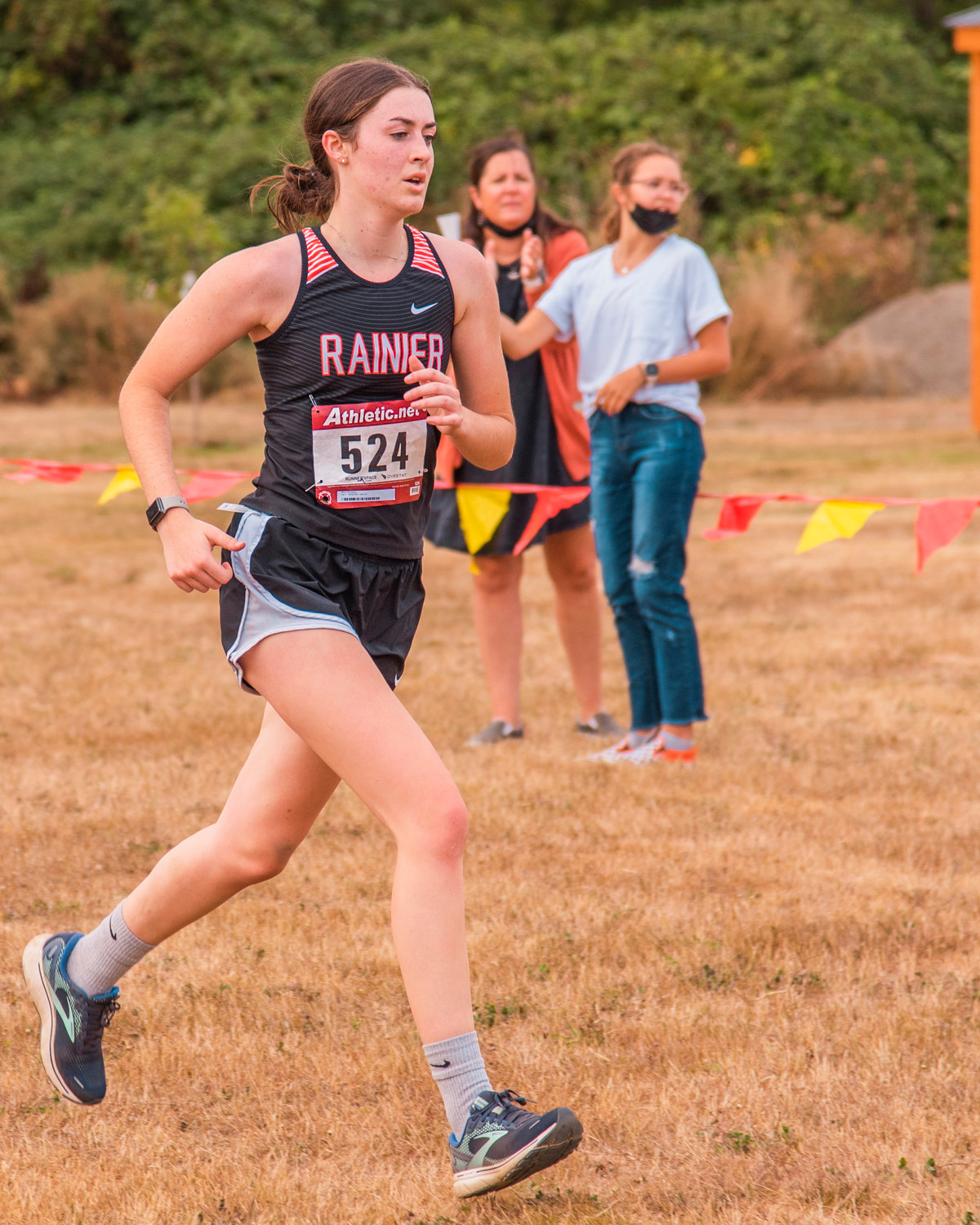 Rainier’s Faith Boesch runs as she nears the finish line Thursday evening in Onalaska.