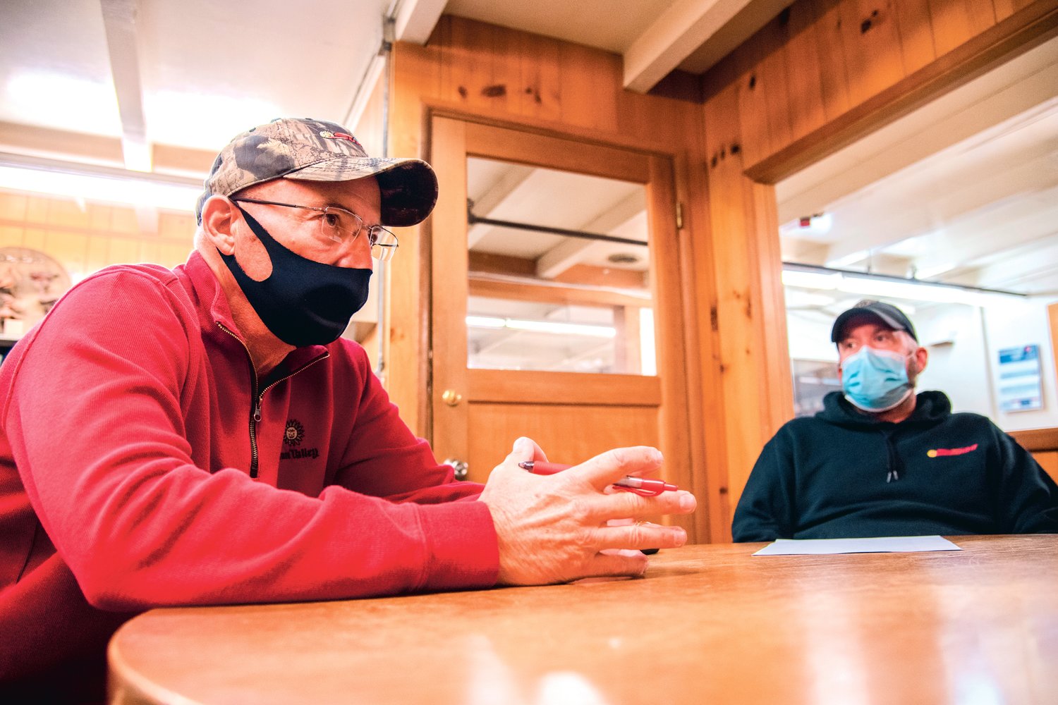 Ron Sturza, left, and Jared Hedgers, co-owners of the Sunbird Shopping Center, talk about the connection they made with customers over the years while in their Chehalis office.