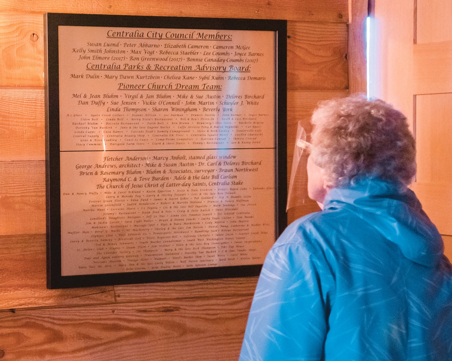Signage commemorates key players behind the construction and planning for the Borst Park Pioneer Church in Centralia on Saturday.