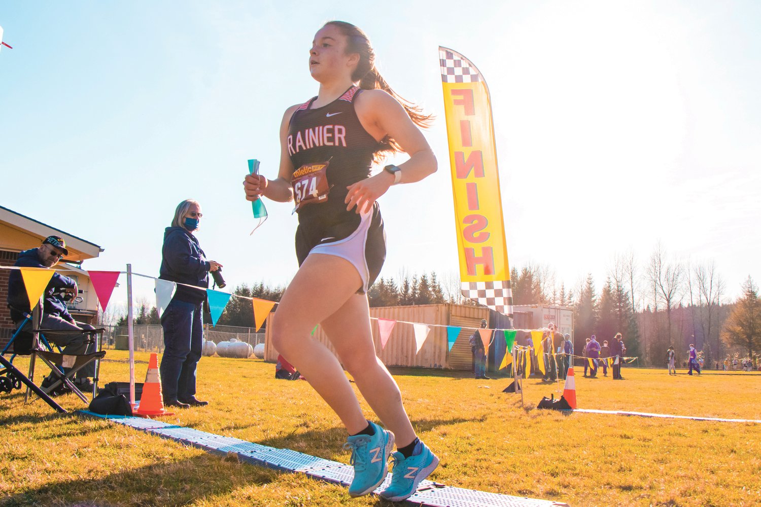 FILE PHOTO -- Rainier’s Selena Niemi finishes first during a girls cross country meet during the 2020-21 season.