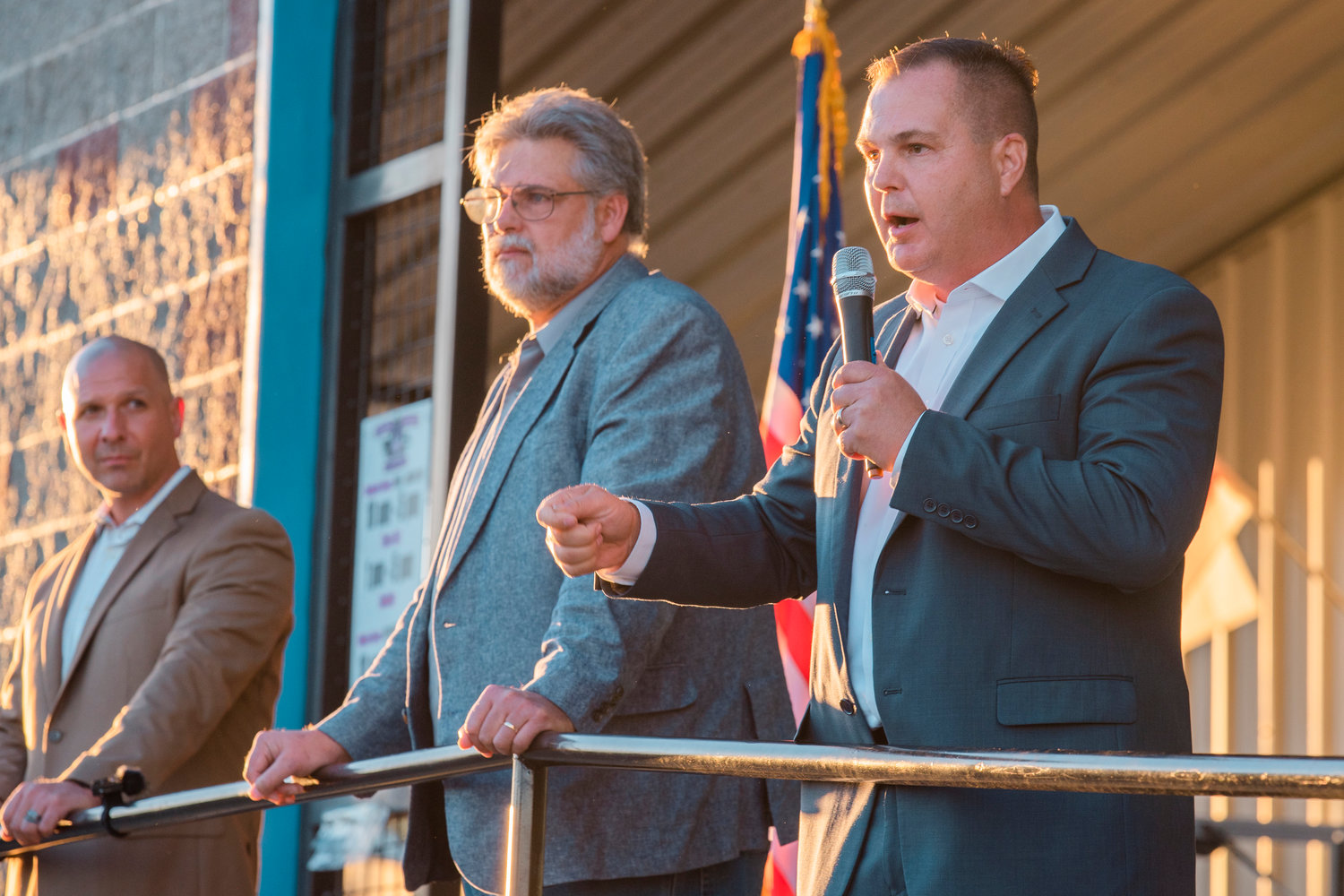 Washington State Sen. John Braun uses a mic to speak to crowds during a town hall event at the Veterans Memorial Museum alongside state Reps. Peter Abbarno and Ed Orcutt in 2021.