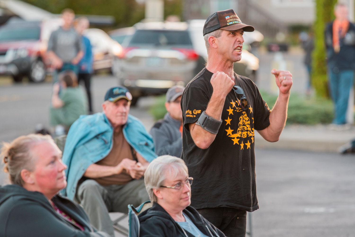 The U.S. Constitution is referenced as community members stand up and demand answers from state representatives during a public town hall meeting Monday evening outside the Veterans Memorial Museum in Chehalis.