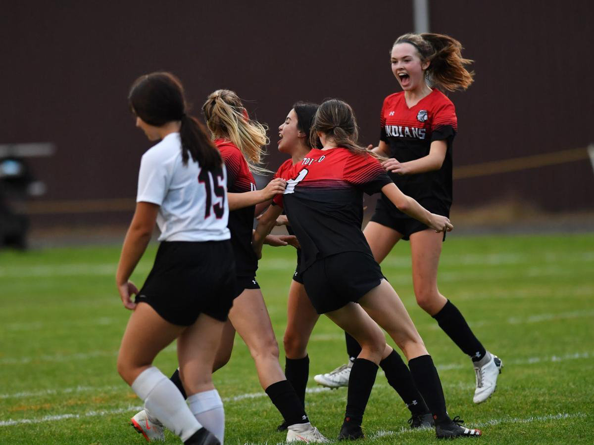 Toledo players celebrate Vanesa Rodriguez' header goal in the 24th minute of the Riverhawks' 9-3 win over Ocosta at home on Wednesday.