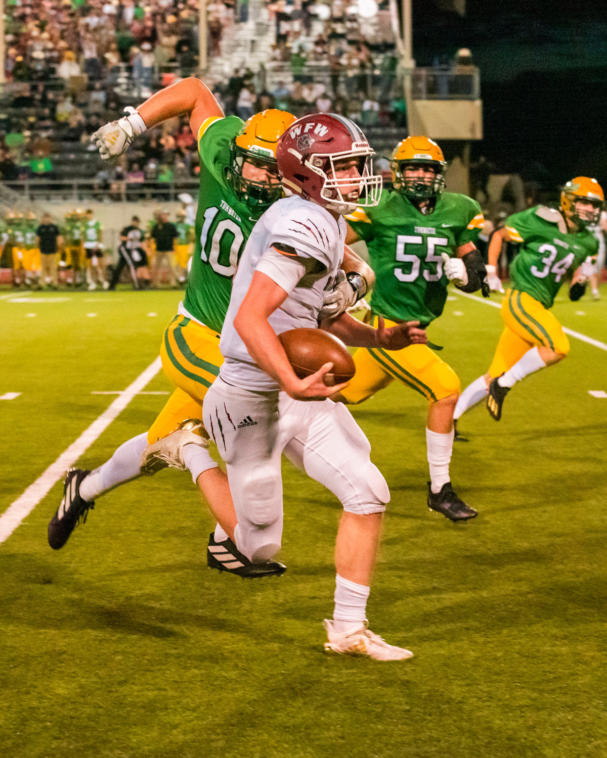W.F. West’s quarterback Gavin Fugate (9) runs for a first down during a game against Tumwater Friday night.