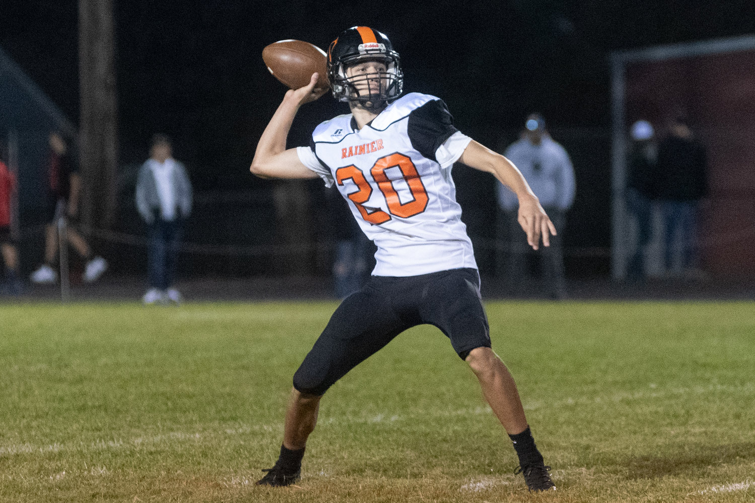 Rainier quarterback Ian Sprouffske attempts a pass in the Mountaineers loss to Napavine Saturday night.