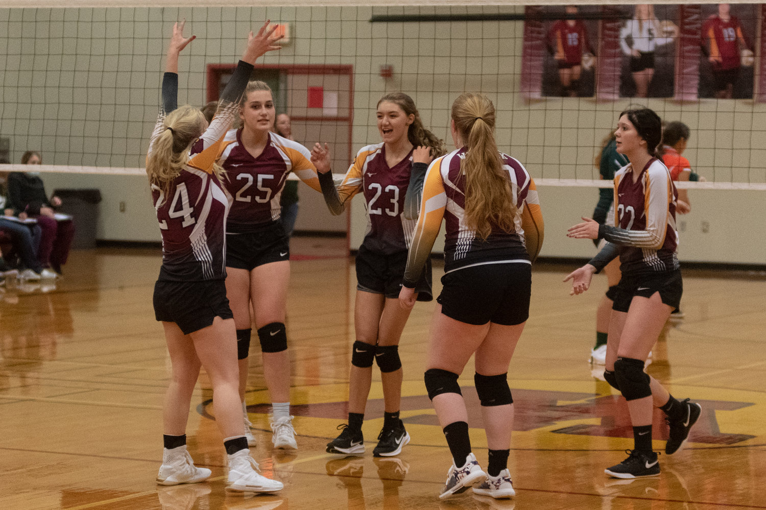 The Winlock girls volleyball team celebrates a point in its four set win over Morton-White Pass Tuesday night.