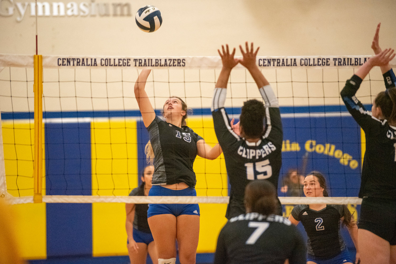 Centralia College's Ayzha Fuller (15) and Jordyn Burks (8) rises for a spike against South Puget Sound on Wednesday.